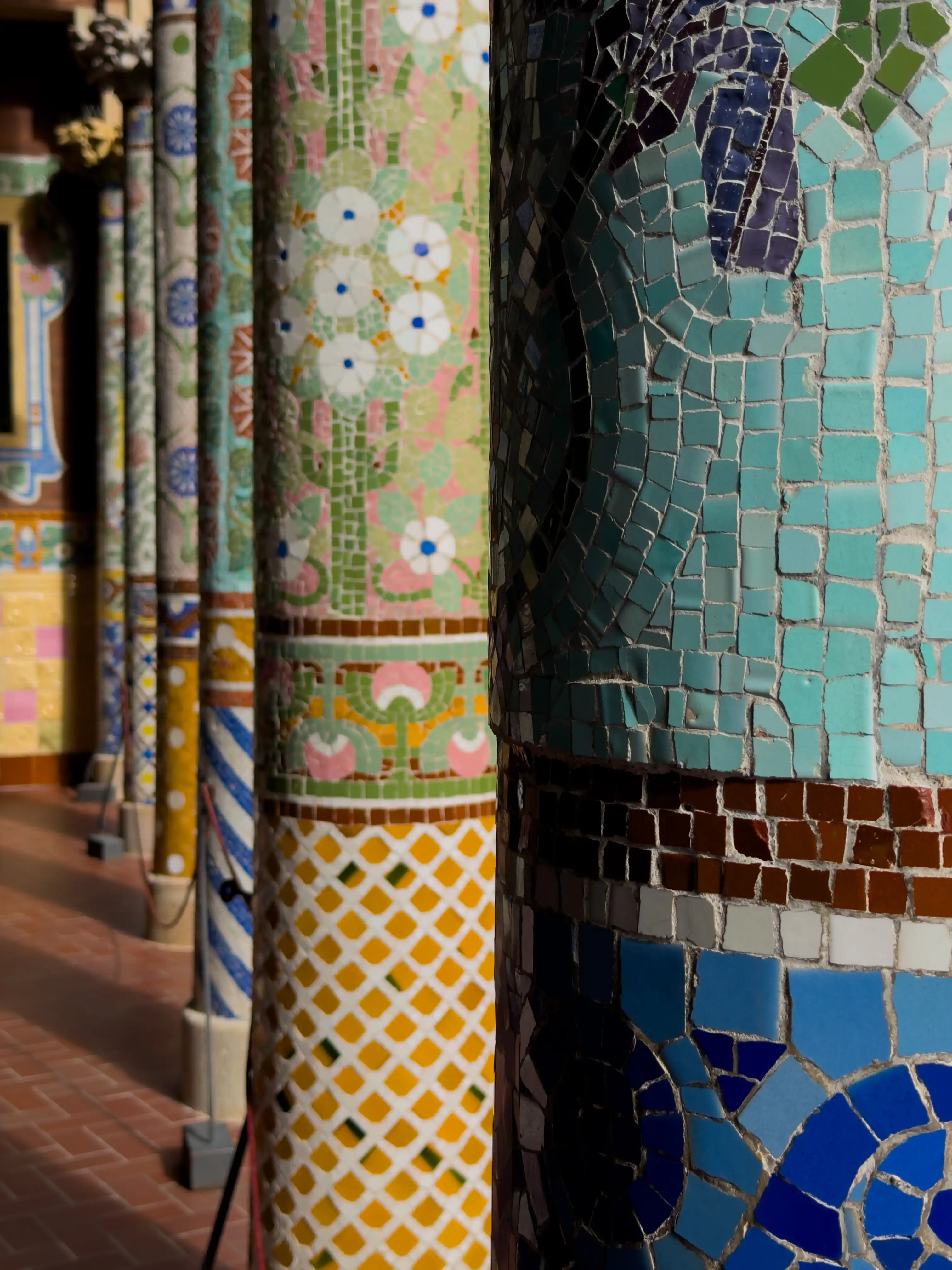 Close view of colorful patterned tile columns.