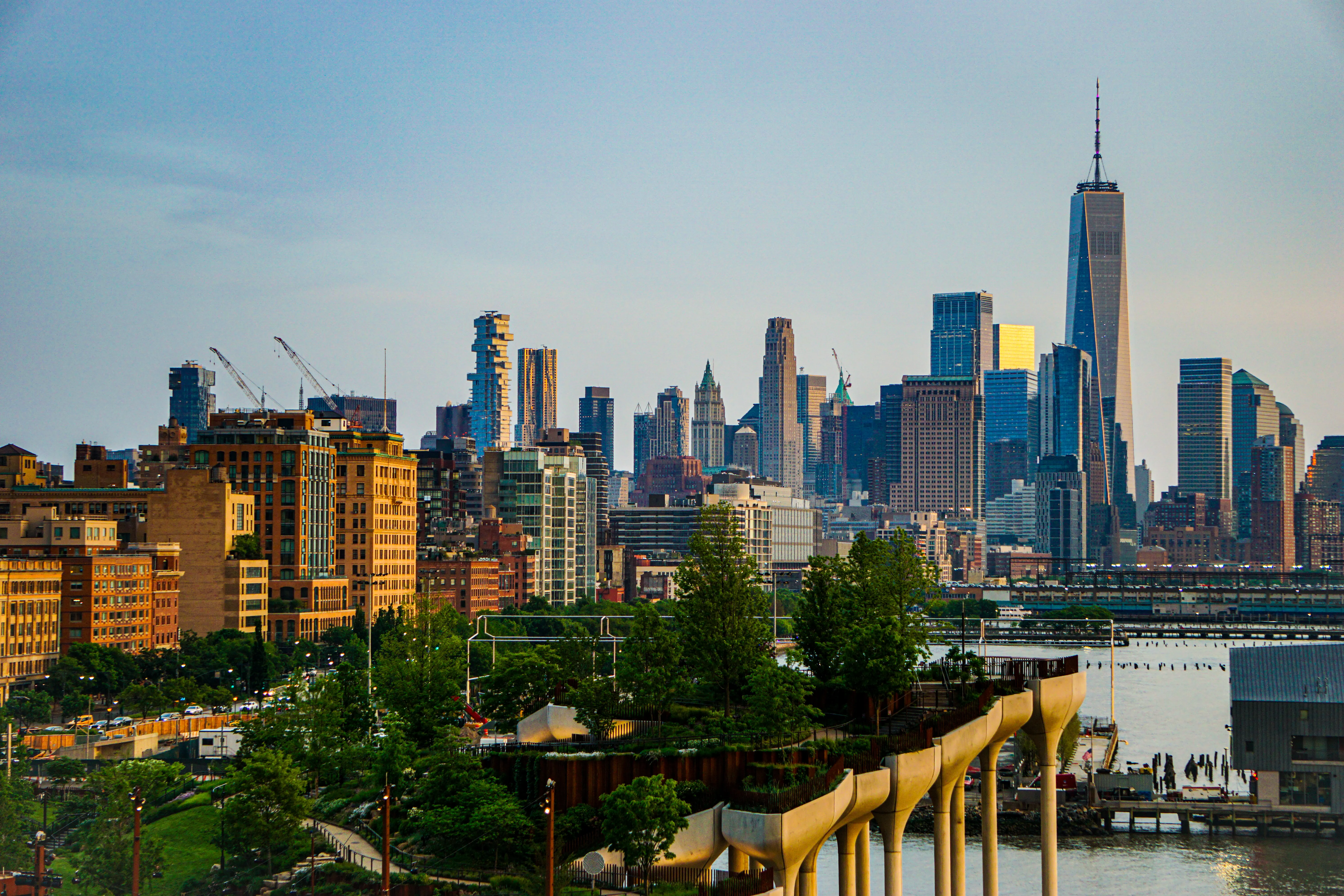 Lower Manhattan skyline seen across the water in daylight.